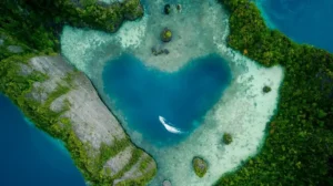 Aerial view of Misool Island lagoon in Raja Ampat with turquoise waters and karst cliffs